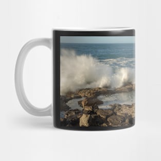 Spray over rocks. Mug